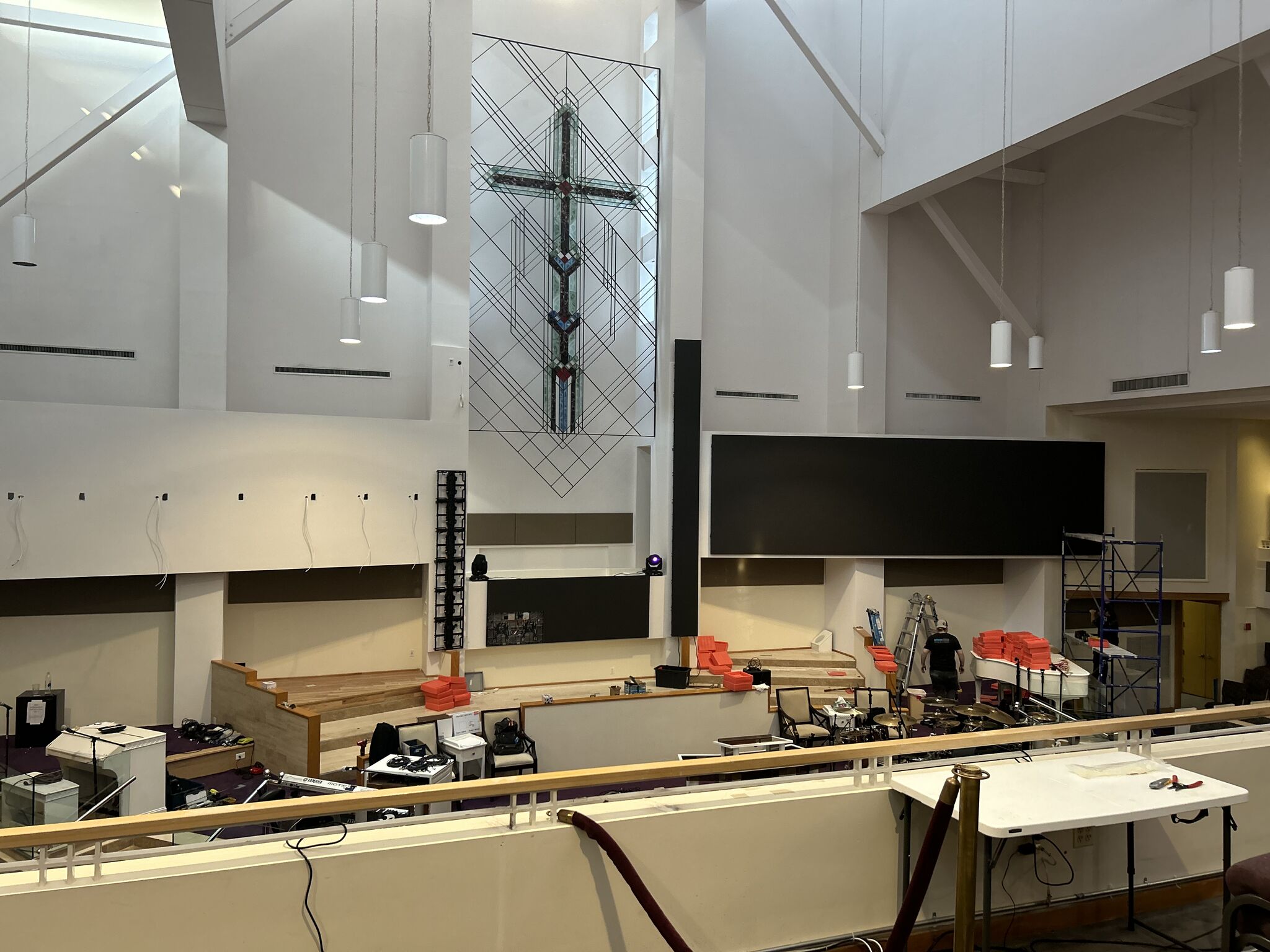 Rizen team members installing LED wall panels in the sanctuary