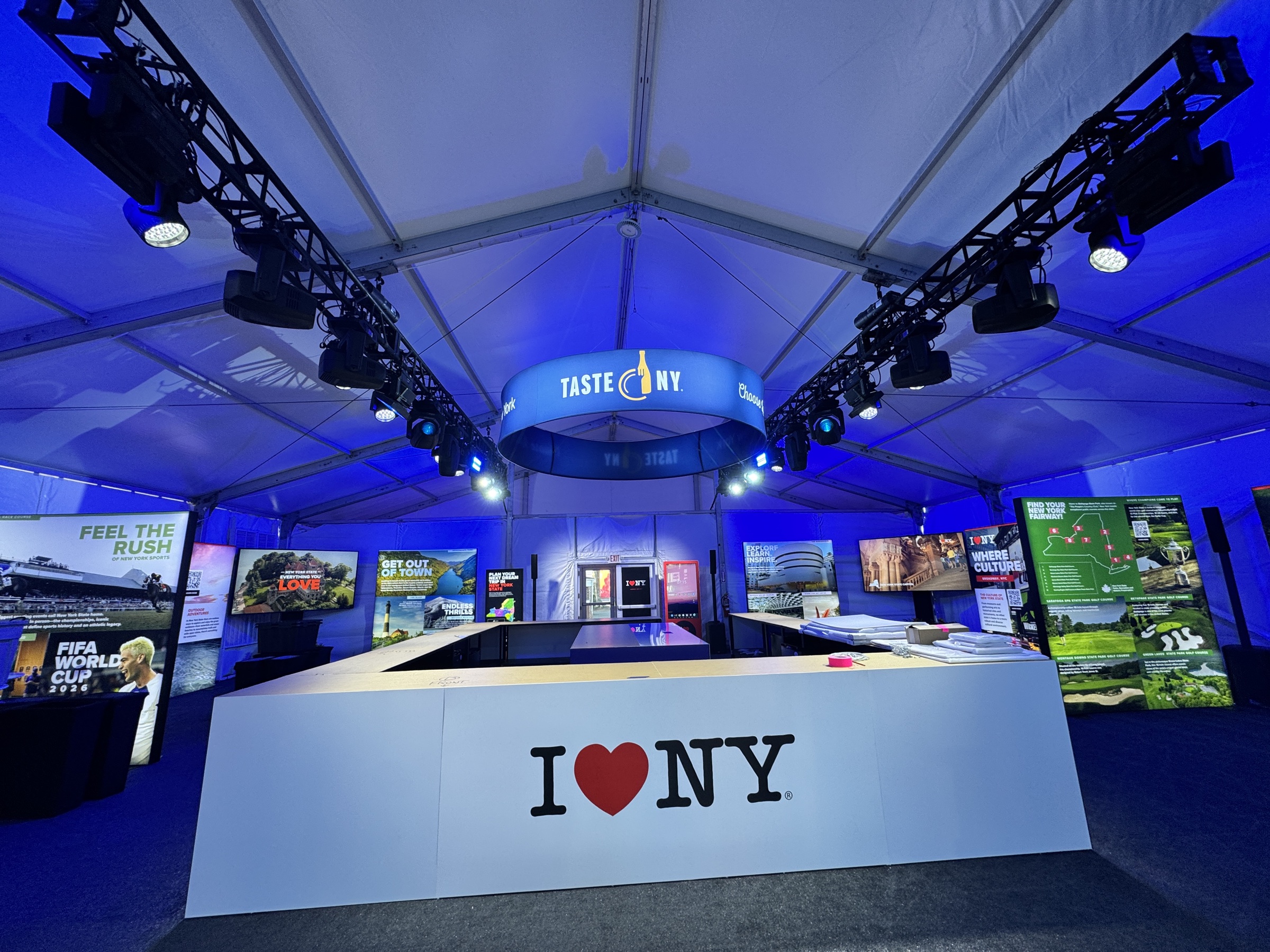 The completed I LOVE NY activation with illuminated truss, moving lights, displays, and scenic elements