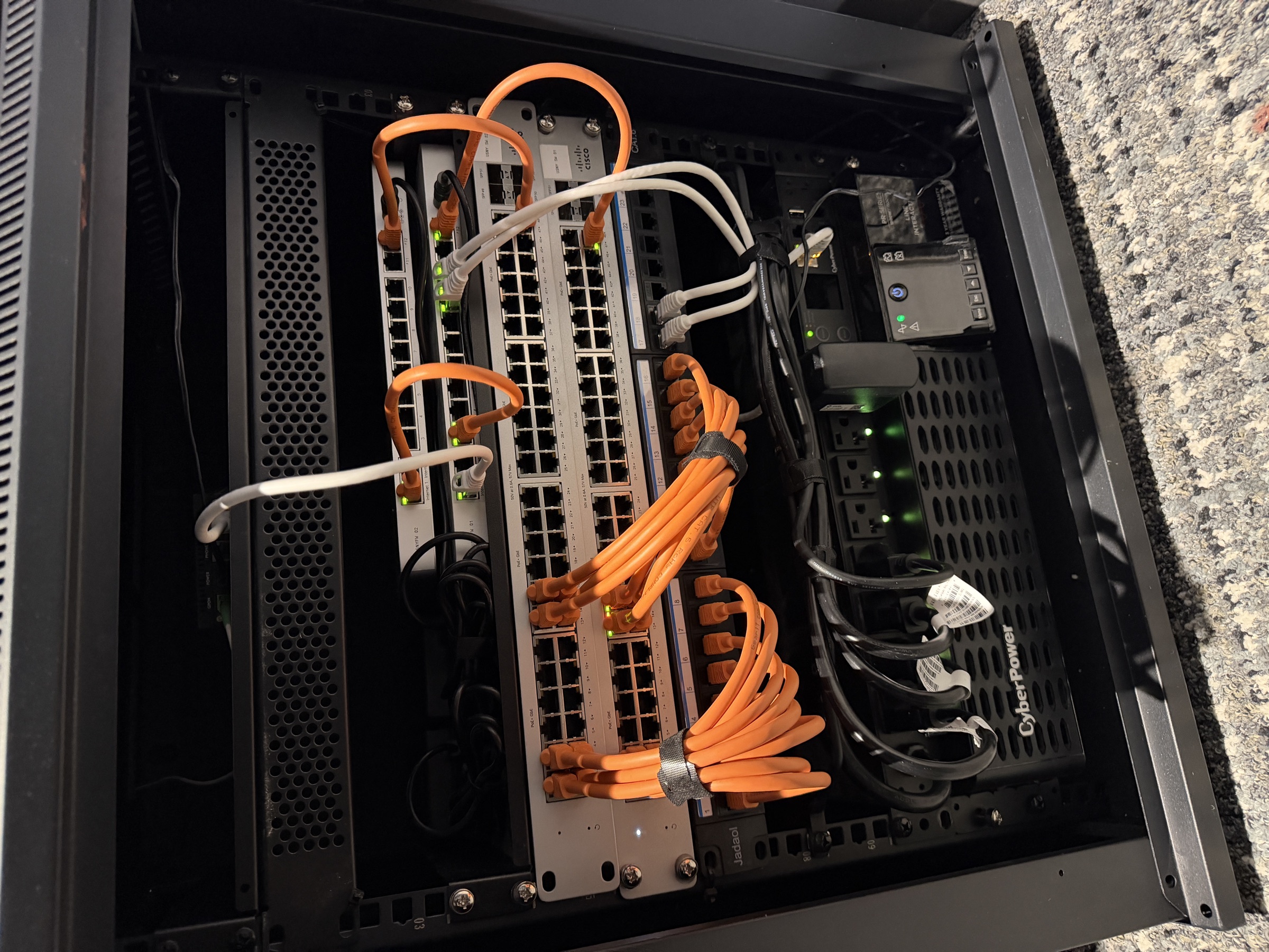 The completed Cisco Meraki network rack with organized low-voltage cabling