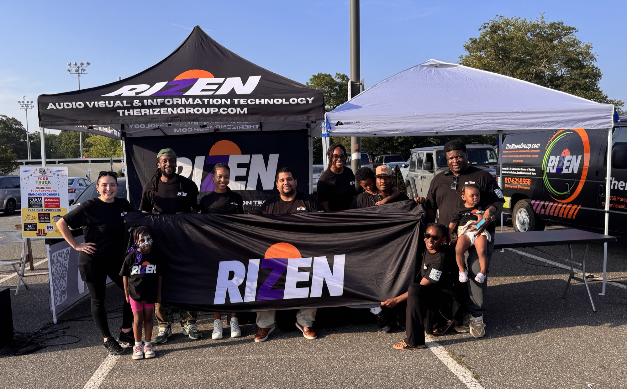 The Rizen Group team and their families together at a community event