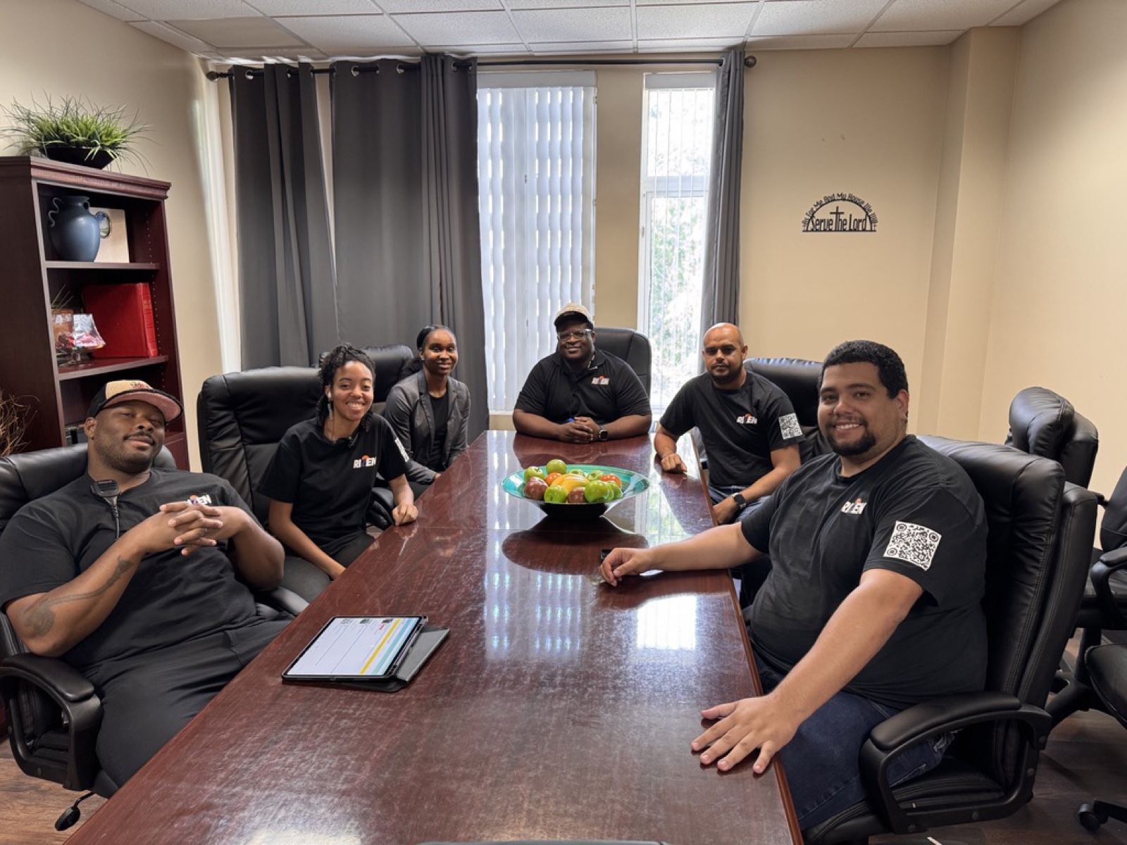 The Rizen Group team gathered around a conference table